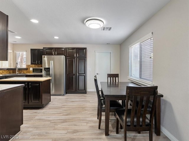 6436 Vinecrest Ave, Las Vegas, NV 89108 - dining room featuring light wood-style flooring and recessed lighting