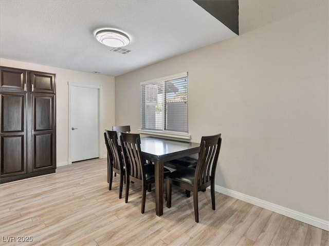 6436 Vinecrest Ave, Las Vegas, NV 89108 - dining room featuring light wood-style flooring and baseboards