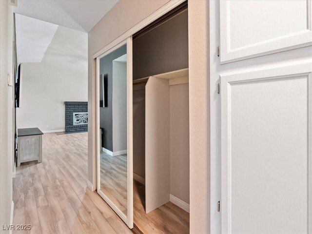 6436 Vinecrest Ave, Las Vegas, NV 89108 - hall featuring light wood-style floors and vaulted ceiling