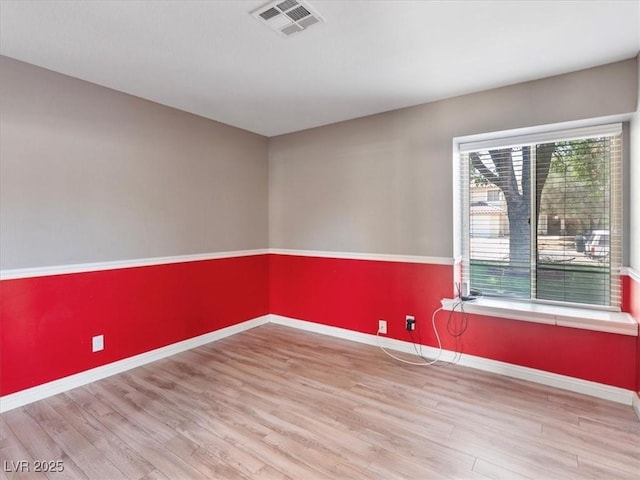 6436 Vinecrest Ave, Las Vegas, NV 89108 - spare room featuring wood finished floors and baseboards