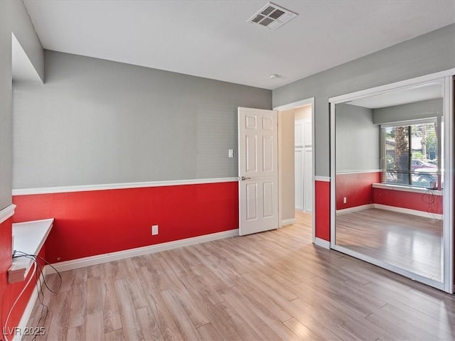 6436 Vinecrest Ave, Las Vegas, NV 89108 - unfurnished bedroom featuring wood finished floors and baseboards