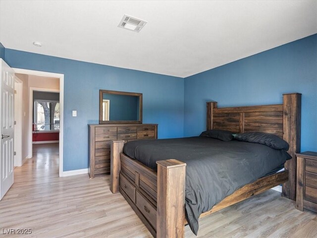 6436 Vinecrest Ave, Las Vegas, NV 89108 - bedroom with wood finished floors and baseboards