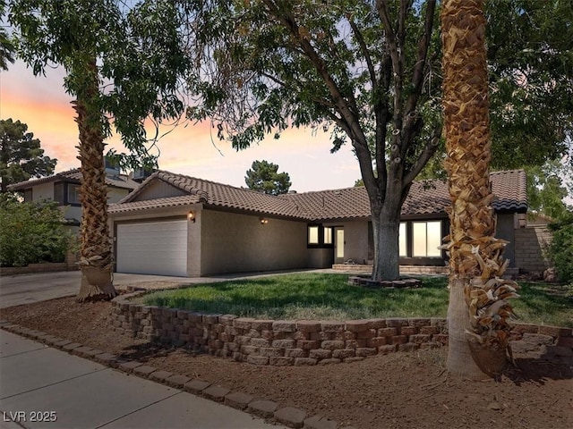 6436 Vinecrest Ave, Las Vegas, NV 89108 - ranch-style home with a tiled roof, a garage, stucco siding, driveway, and a front yard