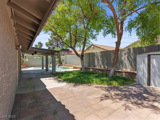 6436 Vinecrest Ave, Las Vegas, NV 89108 - fenced backyard with a patio and ceiling fan