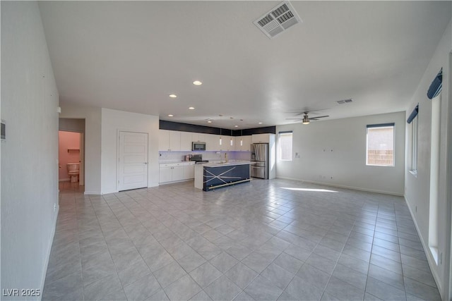 5091 E Beacon Ridge Dr, Pahrump, NV 89061 - unfurnished living room with ceiling fan, baseboards, recessed lighting, and light tile patterned floors