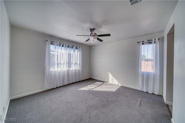 5091 E Beacon Ridge Dr, Pahrump, NV 89061 - empty room featuring ceiling fan, carpet flooring, and baseboards