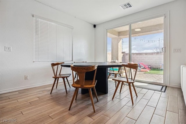 7616 Quail Dust St, North Las Vegas, NV 89084 - dining space featuring light wood-type flooring and baseboards