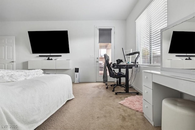 7616 Quail Dust St, North Las Vegas, NV 89084 - bedroom with light carpet, baseboards, and a desk