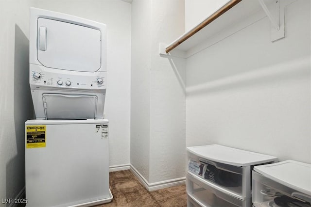 7616 Quail Dust St, North Las Vegas, NV 89084 - laundry area with estacked washer and dryer, carpet flooring, and baseboards
