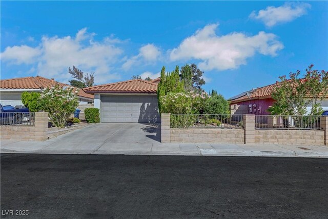 4629 Denwood Dr, Las Vegas, NV 89147 - view of front of house with a tile roof, a garage, and stucco siding