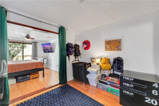 4629 Denwood Dr, Las Vegas, NV 89147 - bedroom featuring a textured ceiling and wood finished floors