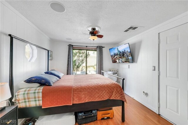 4629 Denwood Dr, Las Vegas, NV 89147 - bedroom featuring wood finished floors, crown molding, ceiling fan, and a textured ceiling