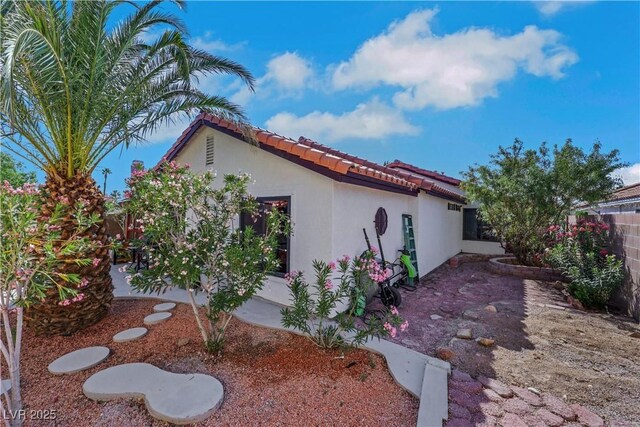 4629 Denwood Dr, Las Vegas, NV 89147 - view of side of home featuring stucco siding and a tile roof