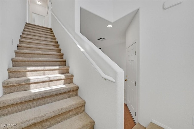 10162 Sunshine Village Pl, Las Vegas, NV 89183 - staircase with recessed lighting and wood finished floors