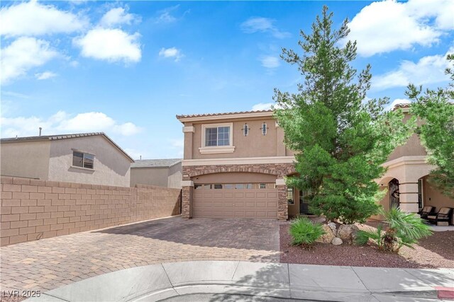 9604 Stoney Mesa Ct, Las Vegas, NV 89139 - view of front of home featuring stone siding, stucco siding, a garage, decorative driveway, and a tiled roof