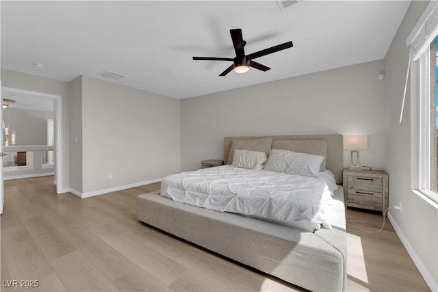 9604 Stoney Mesa Ct, Las Vegas, NV 89139 - bedroom featuring light wood finished floors, baseboards, and multiple windows