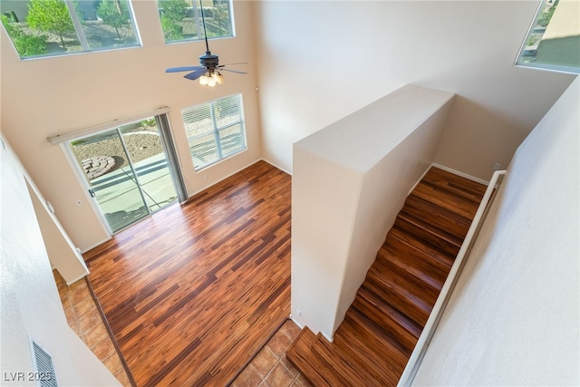 2608 Campobello Ave, North Las Vegas, NV 89081 - stairs with wood finished floors, healthy amount of natural light, a ceiling fan, and a towering ceiling
