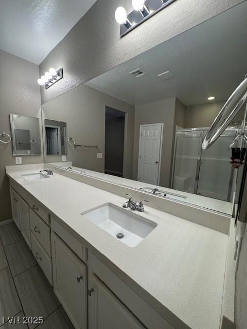 4108 Fairywren Dr, North Las Vegas, NV 89031 - full bath featuring double vanity, a stall shower, and baseboards