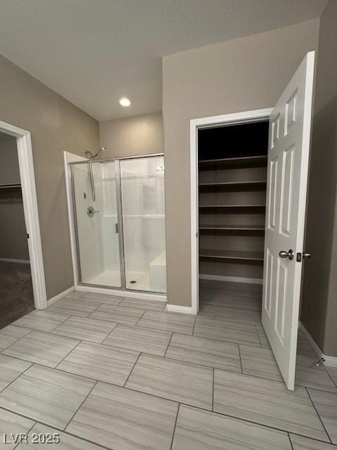 4108 Fairywren Dr, North Las Vegas, NV 89031 - full bath featuring a spacious closet, a shower stall, baseboards, and recessed lighting