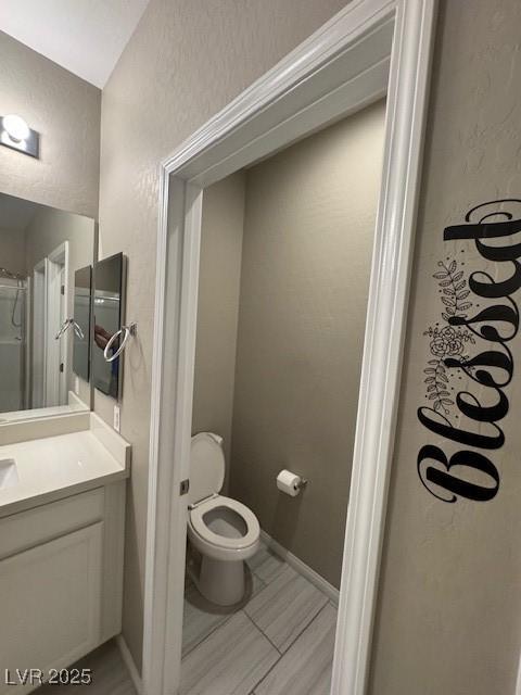 4108 Fairywren Dr, North Las Vegas, NV 89031 - bathroom with vanity, toilet, and a textured wall