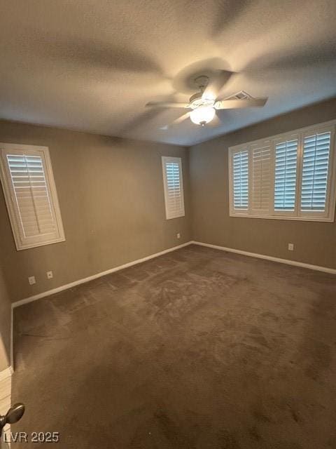4108 Fairywren Dr, North Las Vegas, NV 89031 - unfurnished room featuring ceiling fan, baseboards, and dark colored carpet