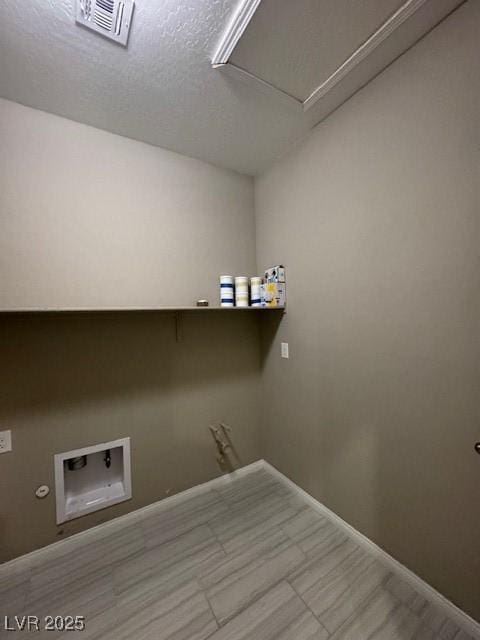 4108 Fairywren Dr, North Las Vegas, NV 89031 - laundry area featuring washer hookup, baseboards, and a textured ceiling