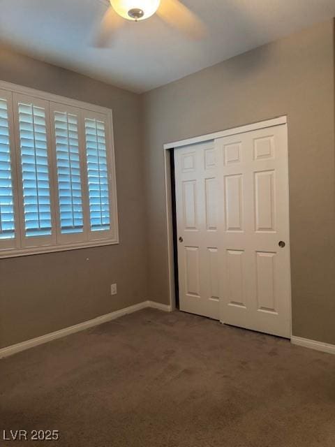 4108 Fairywren Dr, North Las Vegas, NV 89031 - unfurnished bedroom featuring carpet, a closet, baseboards, and ceiling fan