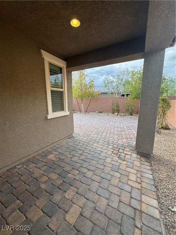 4108 Fairywren Dr, North Las Vegas, NV 89031 - fenced backyard featuring a patio