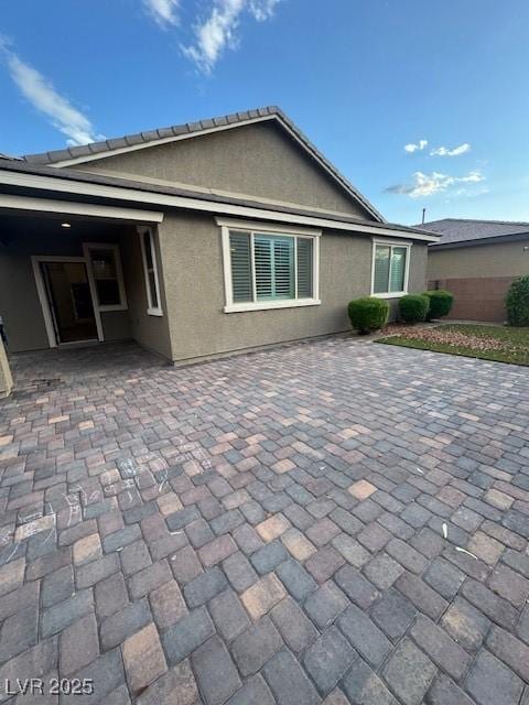 4108 Fairywren Dr, North Las Vegas, NV 89031 - back of house with a patio area and stucco siding