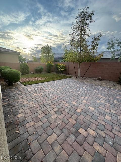 4108 Fairywren Dr, North Las Vegas, NV 89031 - fenced backyard with a patio