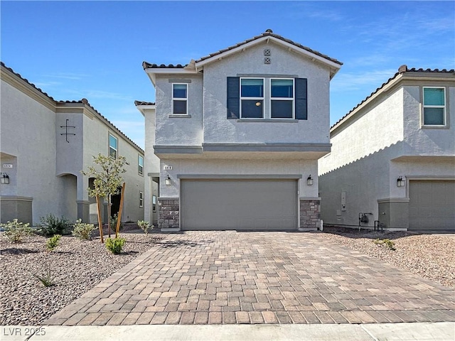 6918 Dandelion Park Ave, Las Vegas, NV 89113 - traditional-style house featuring an attached garage, stucco siding, decorative driveway, a tile roof, and stone siding
