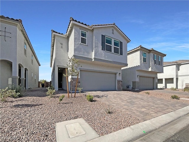6918 Dandelion Park Ave, Las Vegas, NV 89113 - view of front of property with an attached garage, stucco siding, a tiled roof, and decorative driveway