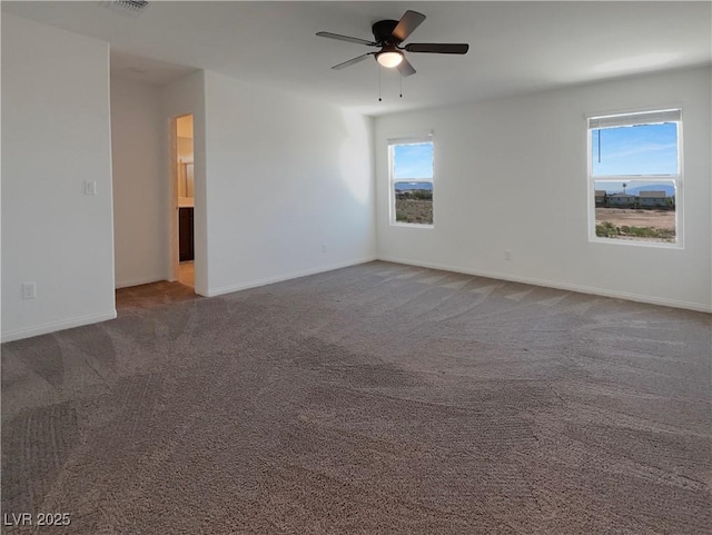 6918 Dandelion Park Ave, Las Vegas, NV 89113 - carpeted spare room featuring plenty of natural light, a ceiling fan, and baseboards