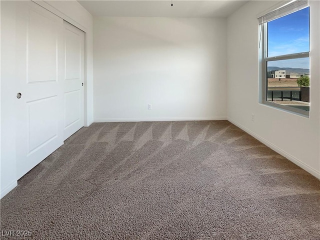 6918 Dandelion Park Ave, Las Vegas, NV 89113 - unfurnished bedroom featuring carpet flooring, baseboards, and a closet