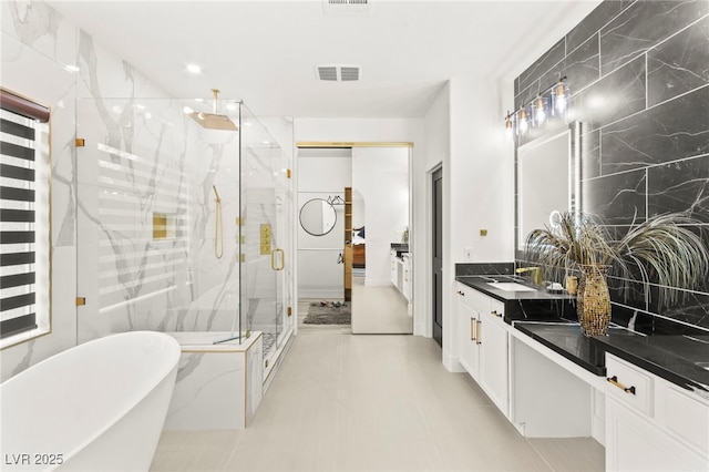 366 Rancho La Costa St, Las Vegas, NV 89138 - bathroom with a marble finish shower, a soaking tub, vanity, recessed lighting, and decorative backsplash
