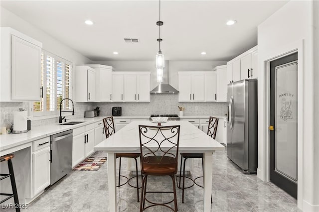 366 Rancho La Costa St, Las Vegas, NV 89138 - kitchen with appliances with stainless steel finishes, wall chimney exhaust hood, a sink, tasteful backsplash, and recessed lighting