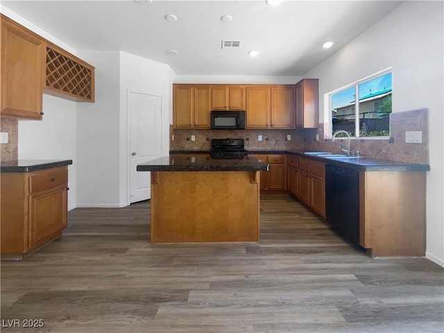 8253 Pearl Oasis Ct, Las Vegas, NV 89139 - kitchen featuring black appliances, a sink, wood finished floors, a kitchen island, and dark countertops