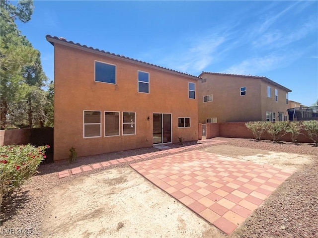 8253 Pearl Oasis Ct, Las Vegas, NV 89139 - rear view of house with stucco siding and a patio