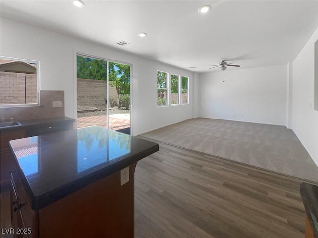 8253 Pearl Oasis Ct, Las Vegas, NV 89139 - unfurnished living room featuring wood finished floors, ceiling fan, recessed lighting, and a sink