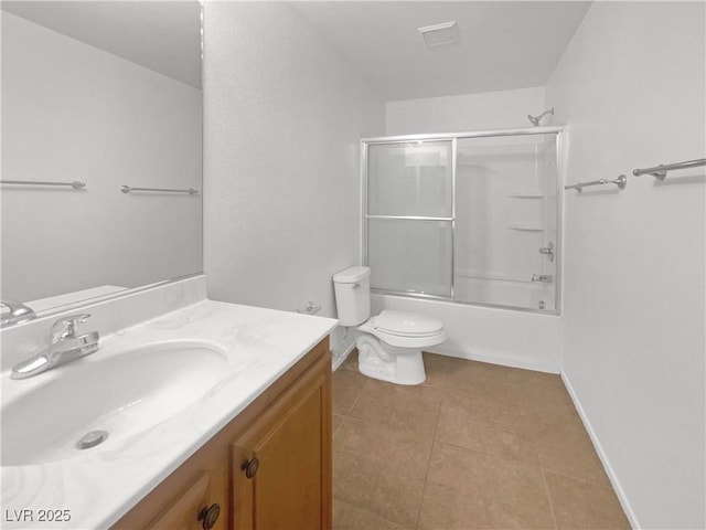8253 Pearl Oasis Ct, Las Vegas, NV 89139 - bathroom featuring vanity, toilet, tile patterned floors, bath / shower combo with glass door, and baseboards