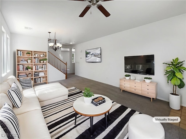 8253 Pearl Oasis Ct, Las Vegas, NV 89139 - living area featuring a ceiling fan, a chandelier, carpet, and stairs