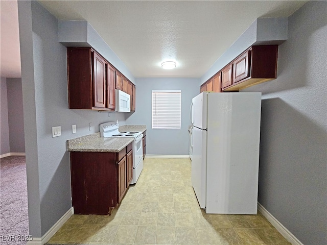 4400 Sandy River Dr Unit 4, Las Vegas, NV 89103 - kitchen with white appliances, light countertops, and baseboards