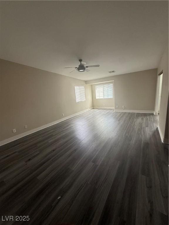 2025 Cary Grant Ct, Las Vegas, NV 89142 - spare room featuring ceiling fan, dark wood-style floors, and baseboards