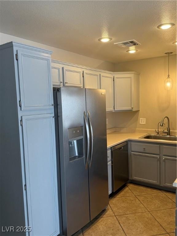 2025 Cary Grant Ct, Las Vegas, NV 89142 - kitchen featuring stainless steel fridge with ice dispenser, dishwasher, a sink, light countertops, and light tile patterned floors