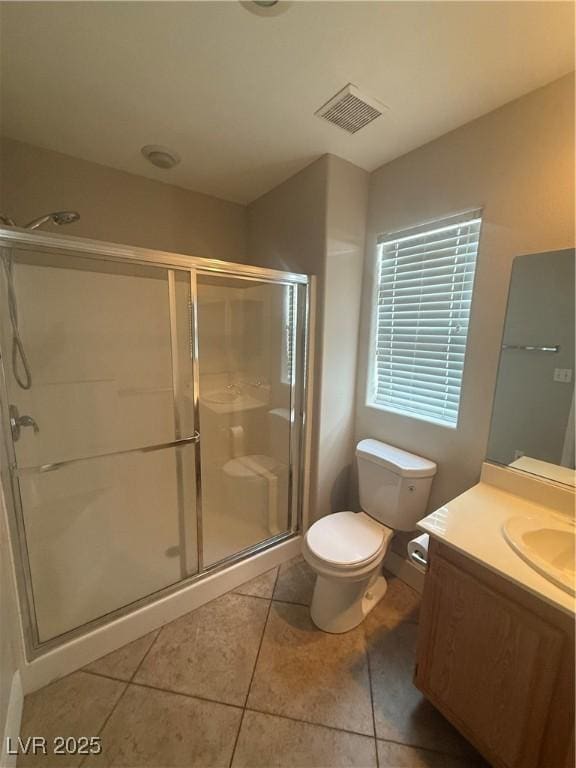 2025 Cary Grant Ct, Las Vegas, NV 89142 - full bath with tile patterned floors, vanity, toilet, and a shower stall
