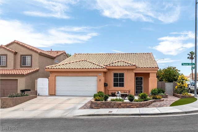 9329 Mountain Cliffs Ave, Las Vegas, NV 89129 - view of front of property with stucco siding, an attached garage, driveway, and a tile roof