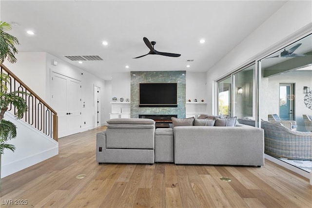 2309 Prometheus Ct, Henderson, NV 89074 - living room featuring ceiling fan, light wood-type flooring, stairway, and recessed lighting