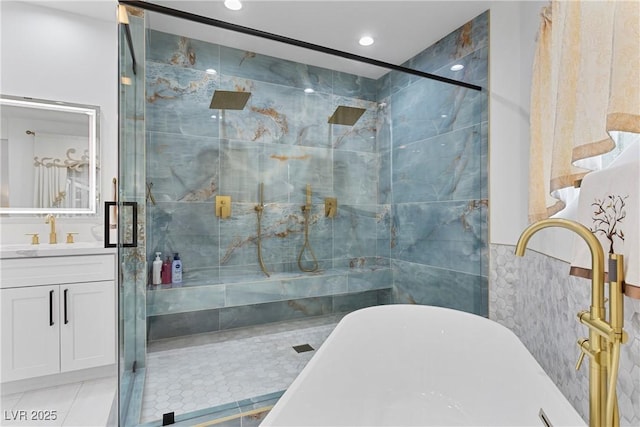 2309 Prometheus Ct, Henderson, NV 89074 - bathroom with a soaking tub, a shower stall, vanity, tile patterned floors, and recessed lighting