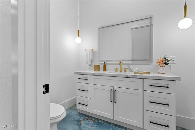 2309 Prometheus Ct, Henderson, NV 89074 - bathroom with marble finish floors, vanity, toilet, and baseboards