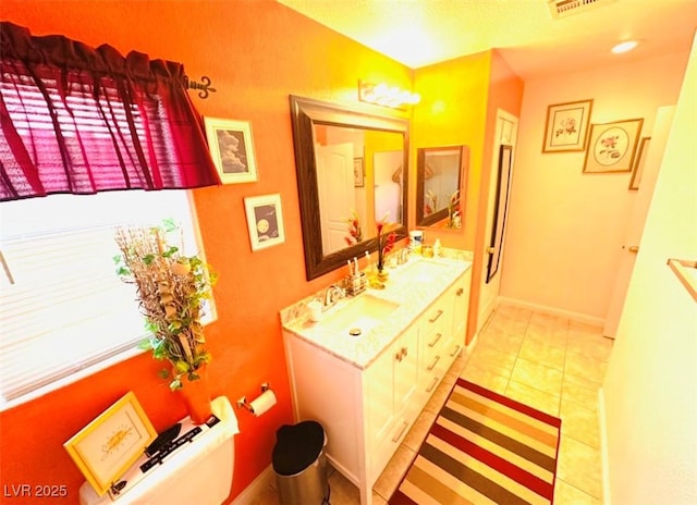 8156 Blue Hope Diamond Ln, Las Vegas, NV 89139 - bathroom featuring double vanity and baseboards